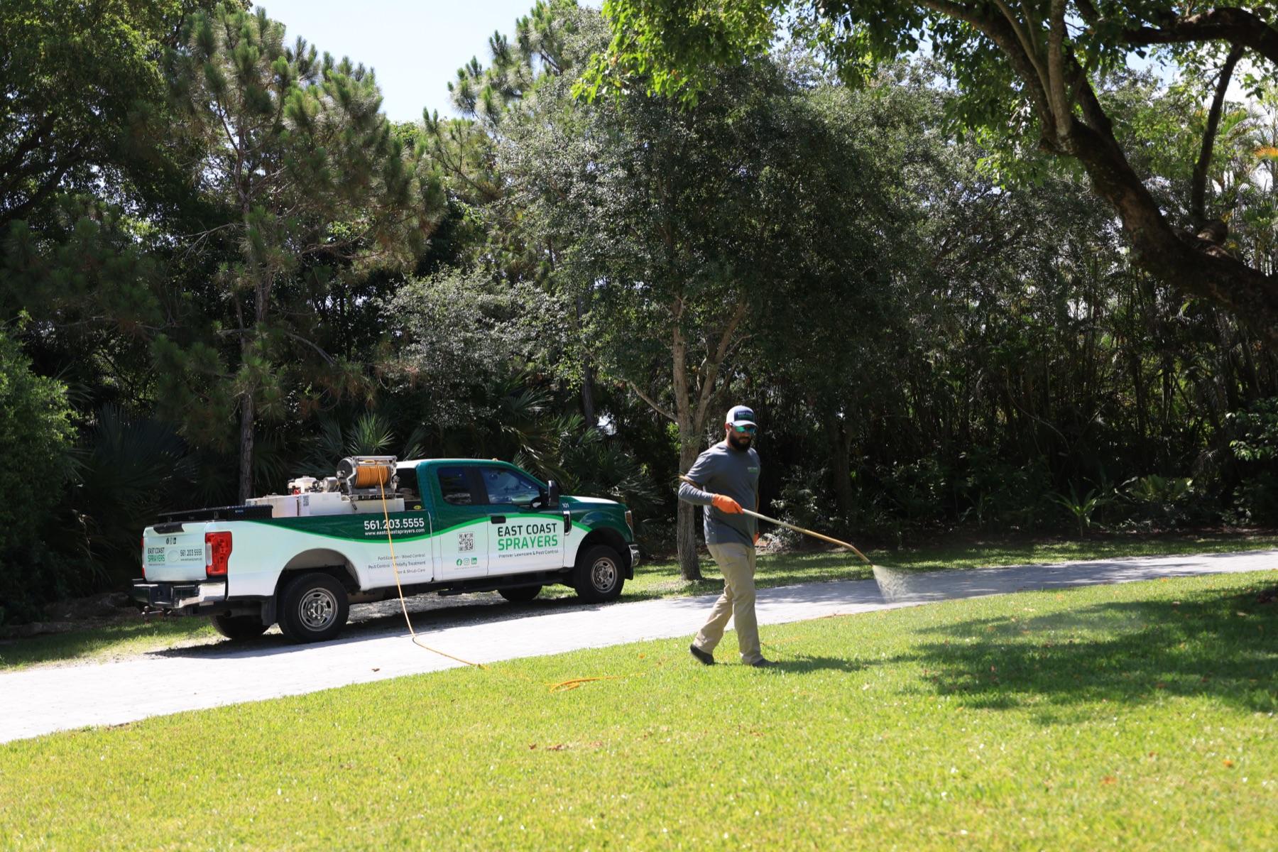 East Coast Sprayers technician walking a property in Palm Beach County