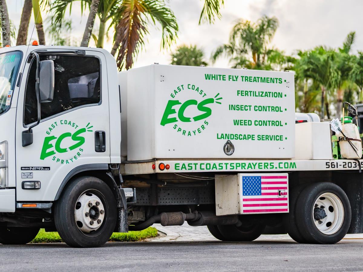 East Coast Sprayers branded service truck listing all treatments offered